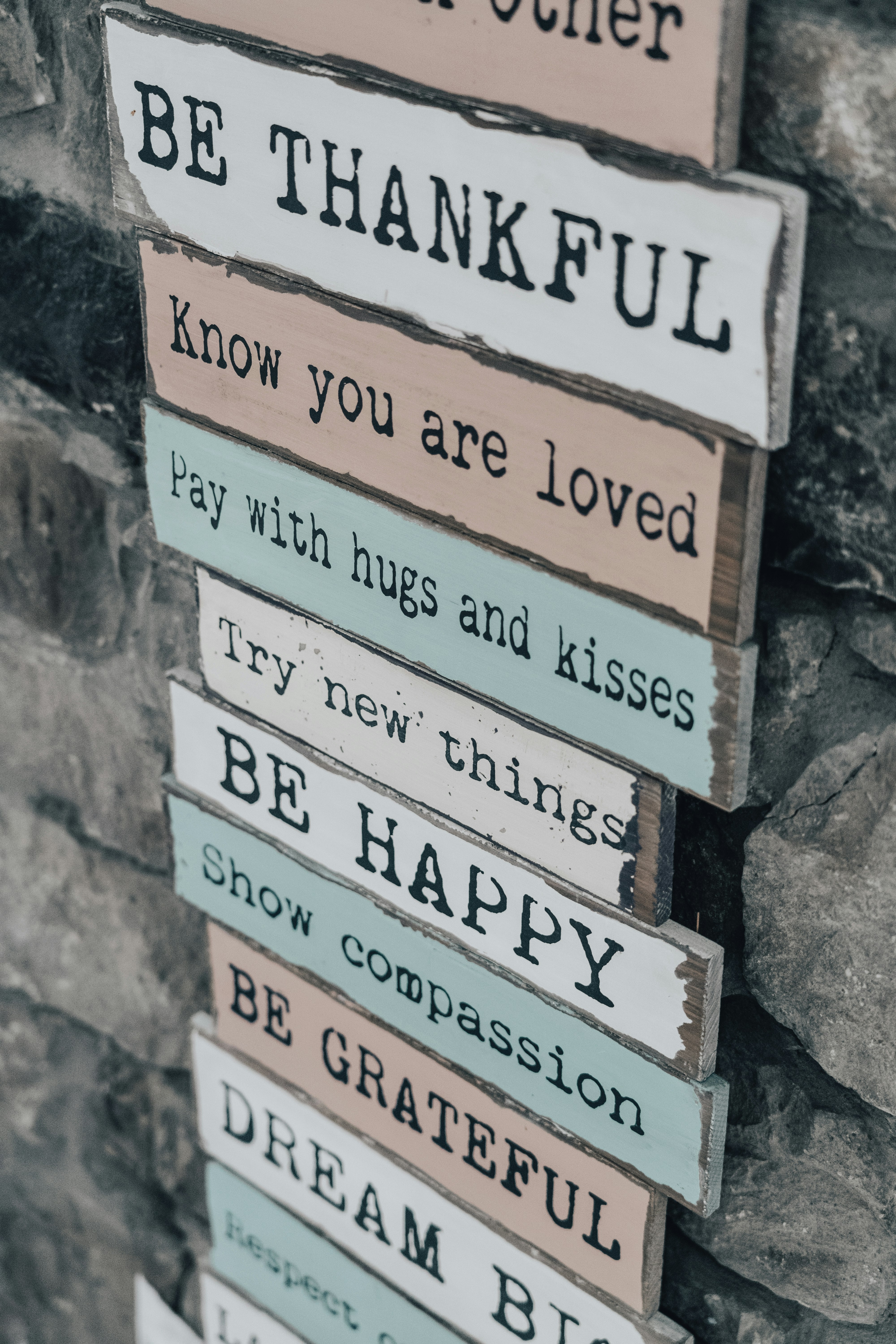 white and brown wooden signage